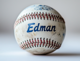 Tommy Edman baseball with blue lettering on white baseball